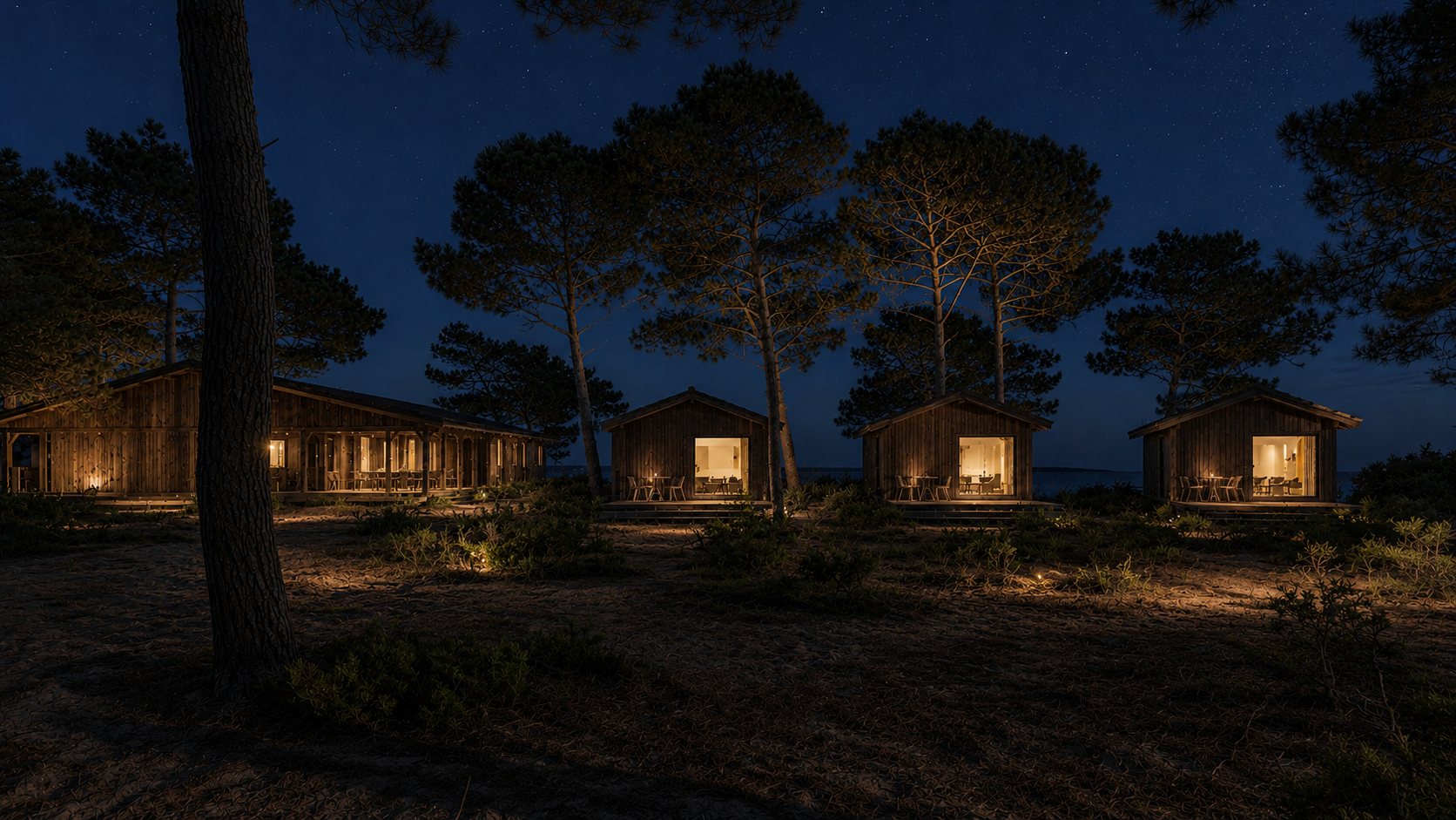 Double Horizon de nuit — volumes en bois illuminés dans la pinède du Cap Ferret